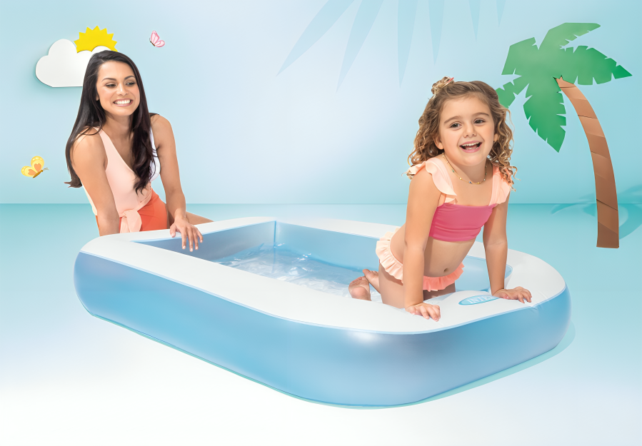 Woman and child playing in an inflatable pool with palm tree and cloud decorations.