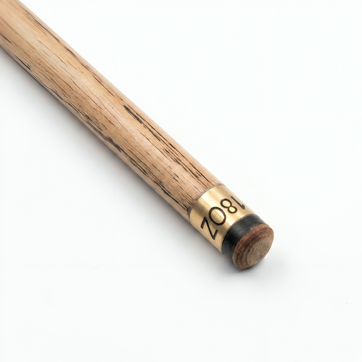 Close-up of a wooden pool cue with a gold tip on a white background