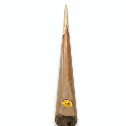 Wooden drumstick with a brand label on a white background