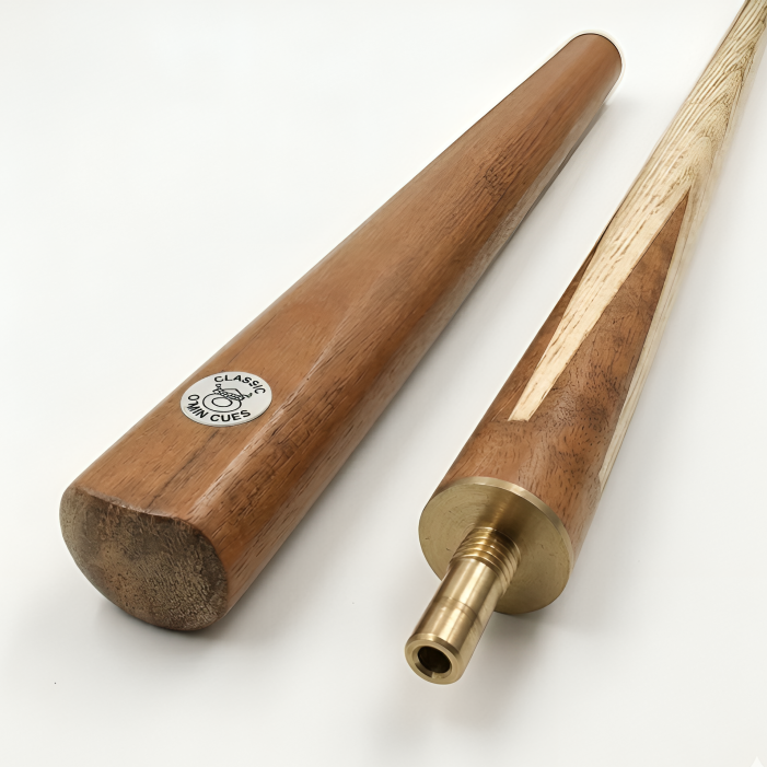 Two pool cues, one wooden and one with a brass tip, on a white background.