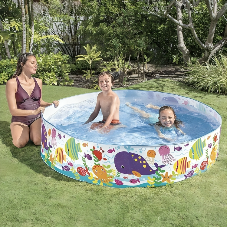 Inflatable pool with colorful sea creature design on a grassy area with children and a woman.